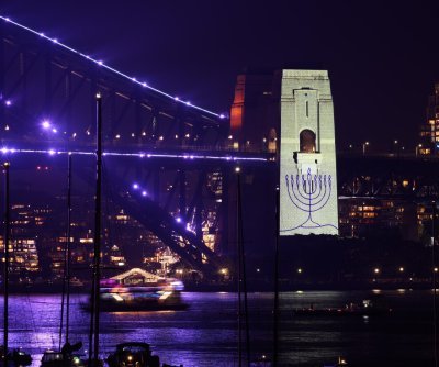 Australia welcomes new year with extra security, tribute to victims